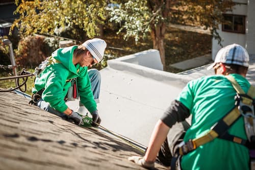 solar-panel-installation-crew-members-on-roof-of-h-2024-11-03-04-48-58-utc (1).jpg